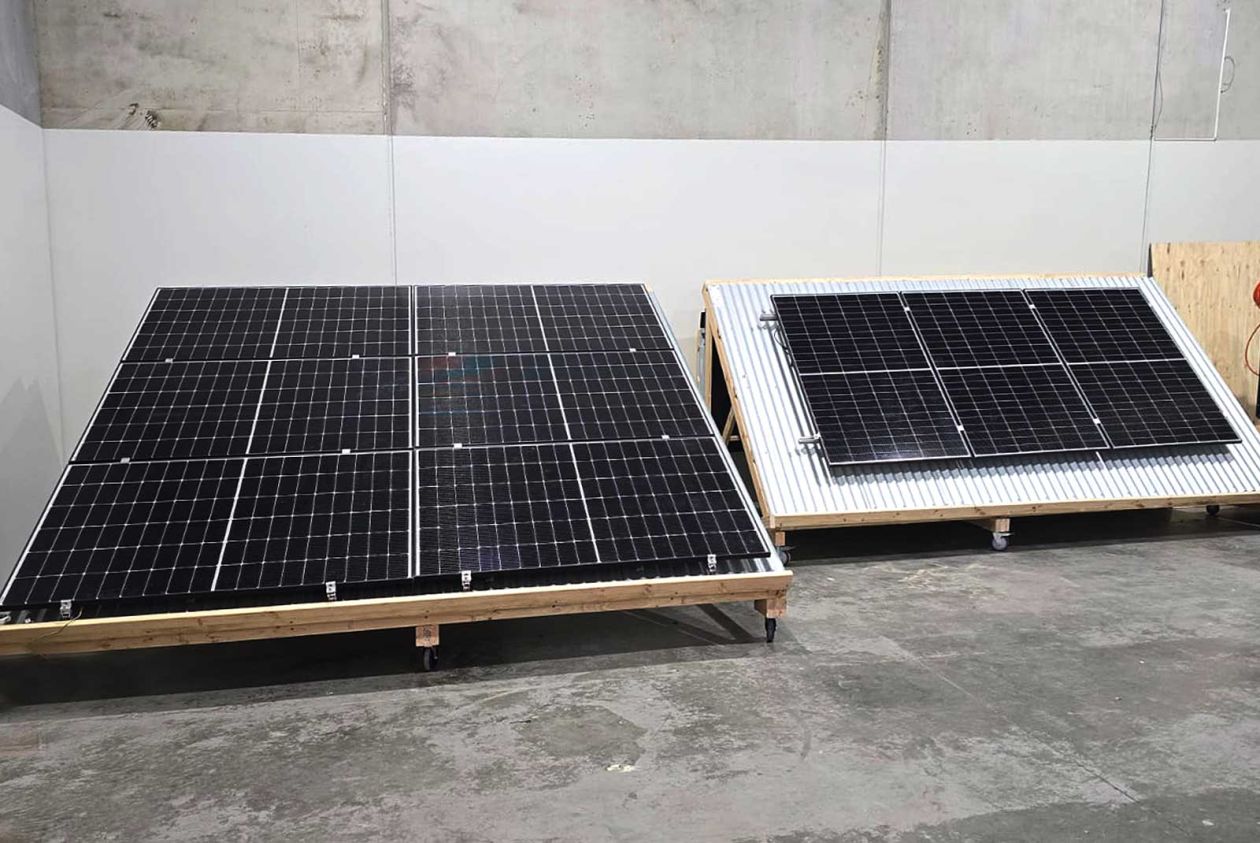 Two solar panel training rigs set up in the workshop for hands-on electrical and renewable energy training.
